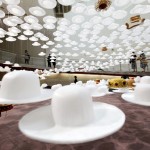 Visitors view creations by Japanese hat designer Akio Hirata at an exhibition in Tokyo