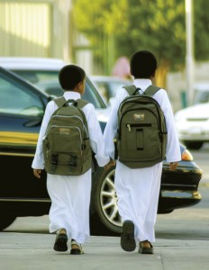 Saudi schoolboys walk on their way to sc