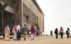 Staff members and students walk on campu